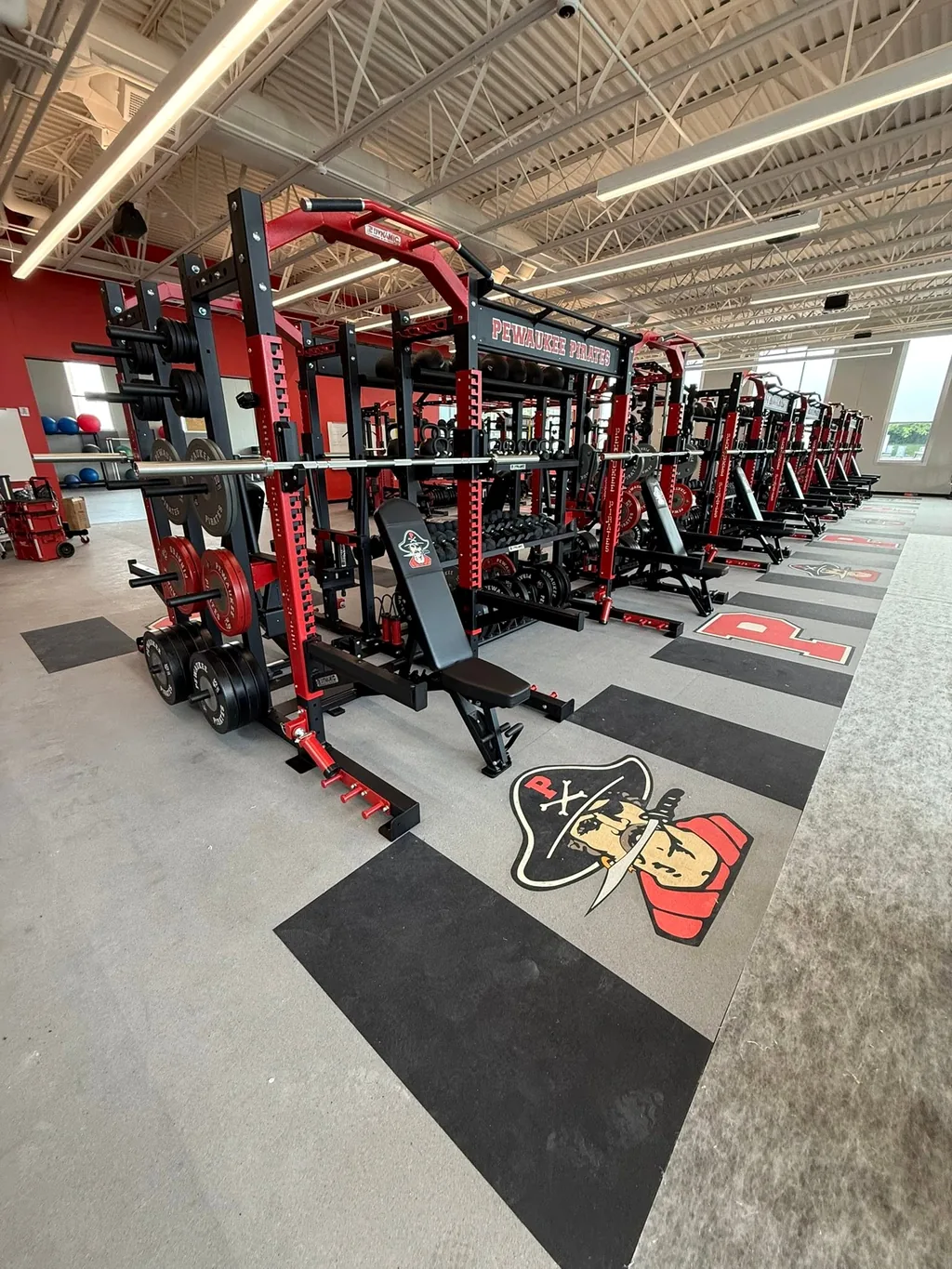 Row of Pewaukee High School power racks and benches installed by AFS